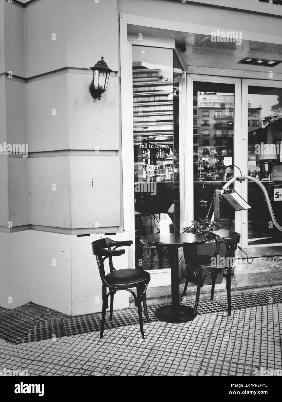 Chairs And Tables Against The Wall Stock Photo Alamy