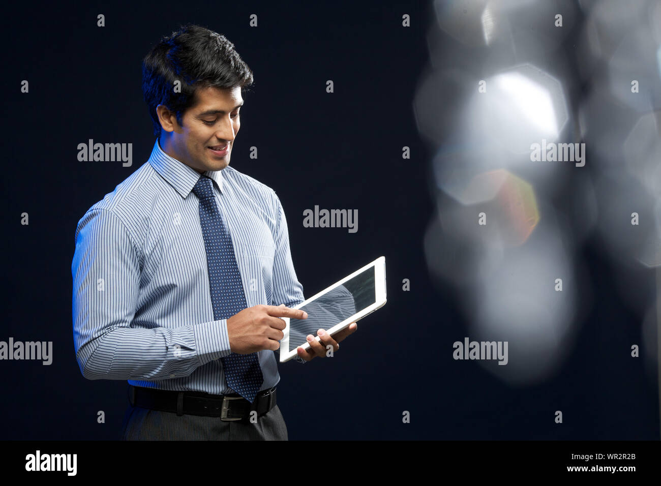 Businessman using digital tablet Stock Photo - Alamy