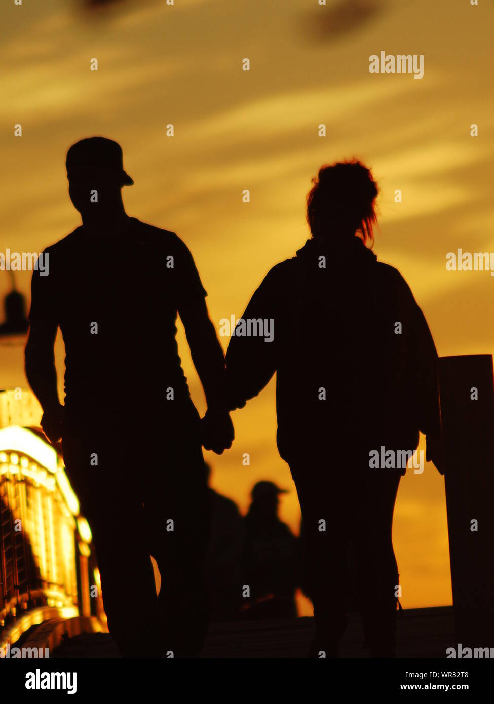 Couple walking holding hands silhouette hi-res stock photography and ...