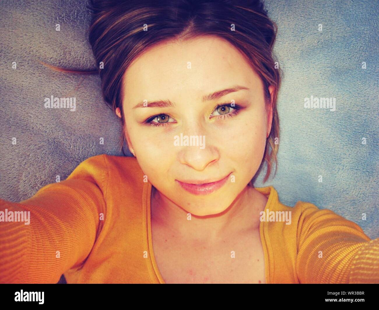 Young Woman Lying Down On Blanket Stock Photo Alamy