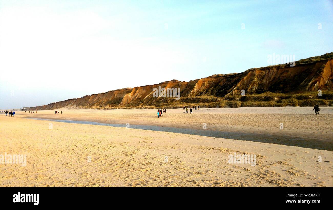 Tourists Walking On Beach In Sylt Island Stock Photo