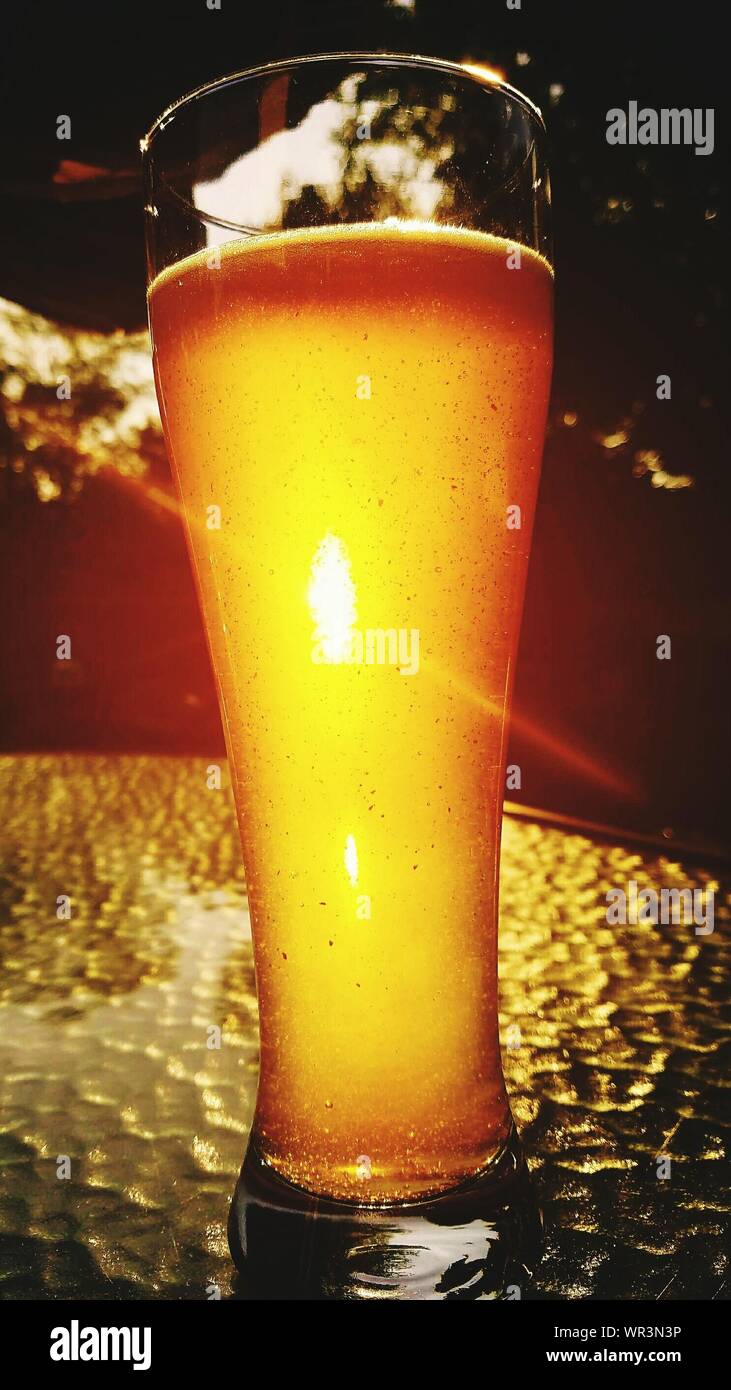 Close-up Of Beer In Pint Glass On Table Stock Photo