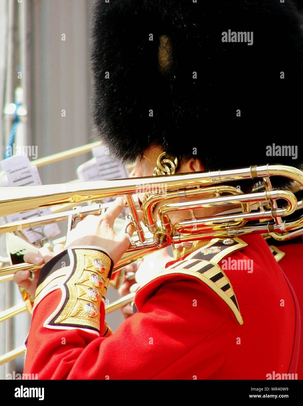 Side View Of British Royal Guard With Brass Instrument On Shoulder Stock Photo