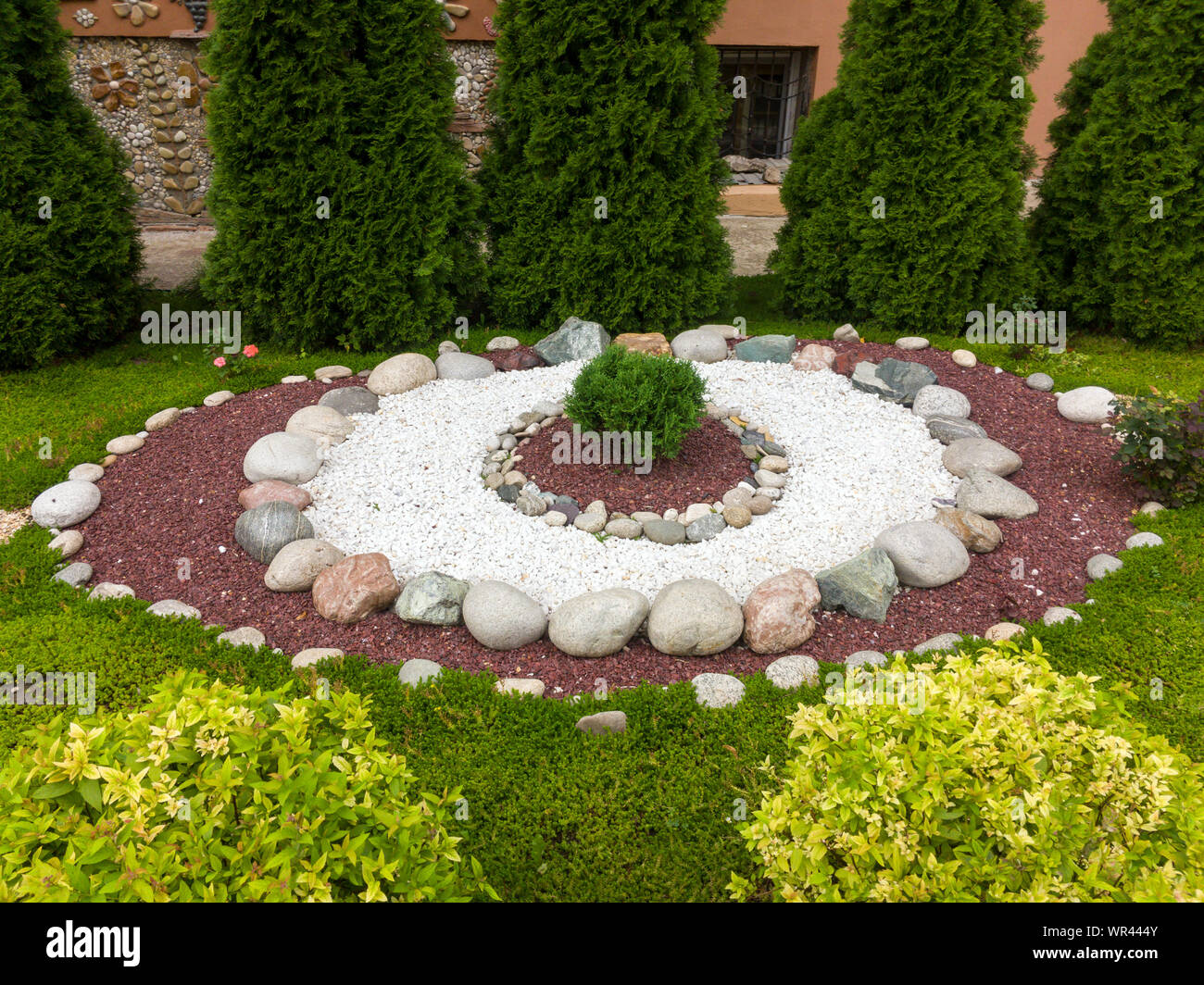 Making flower beds in the park with stones Stock Photo - Alamy