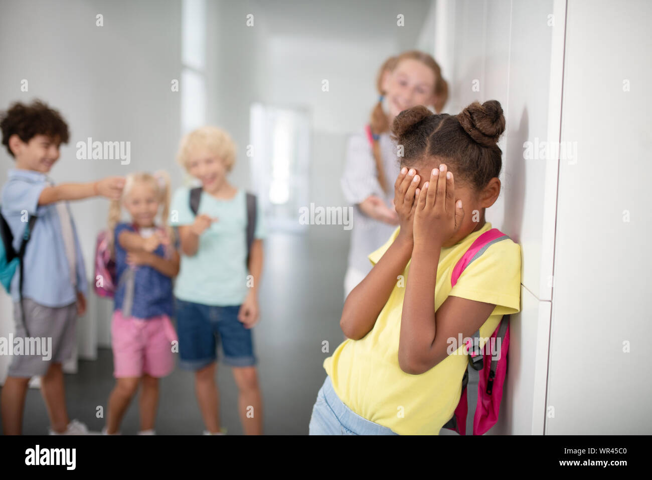 Dark-skinned Girl Closing Her Face While Suffering From Bullying Stock 