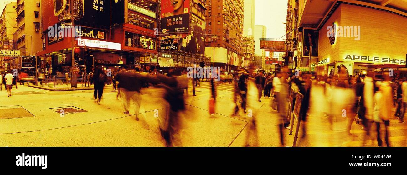 Multi Exposed Image Of Crowd Walking City Street Stock Photo