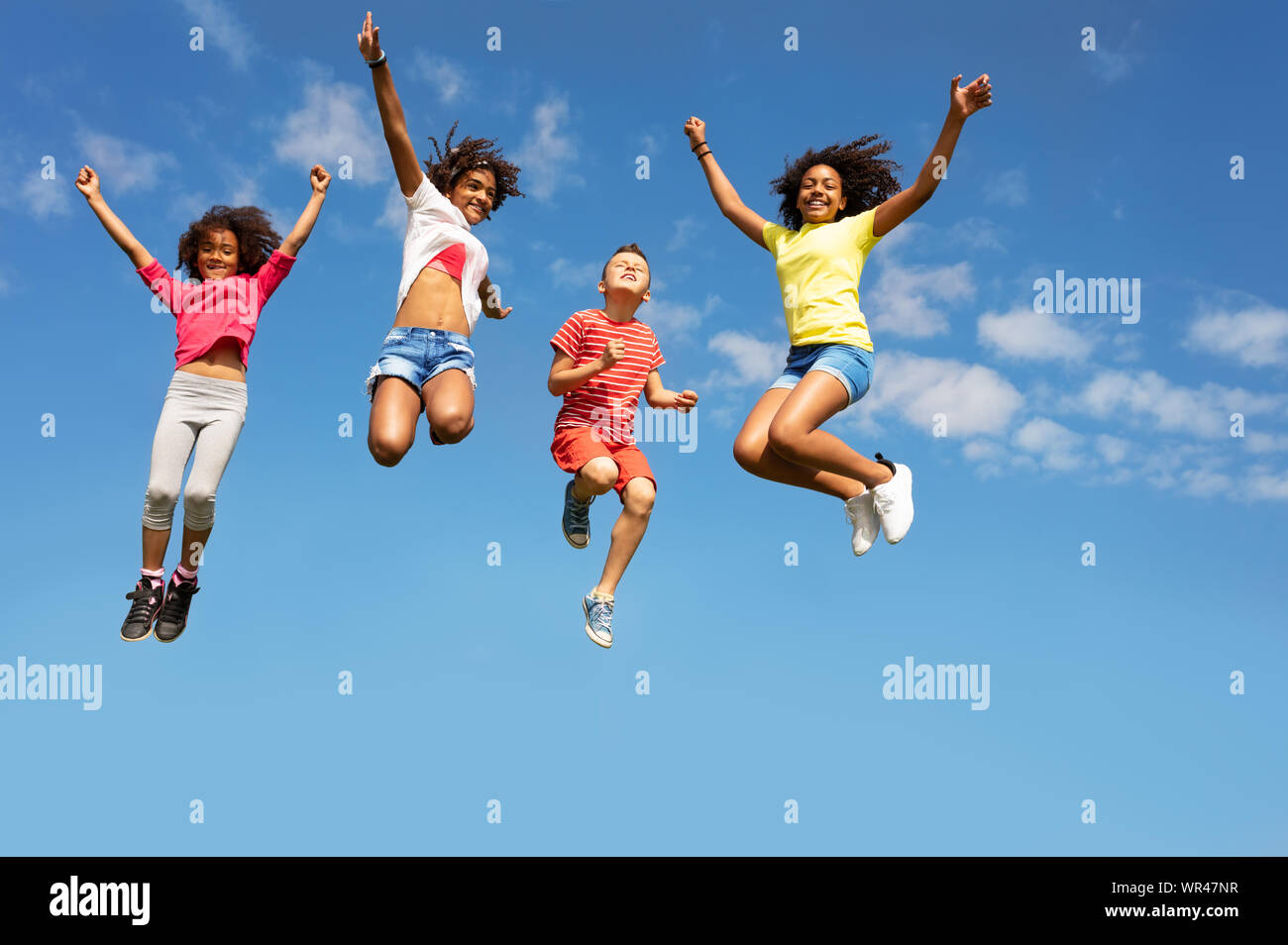 Kids jump hi-res stock photography and images - Alamy