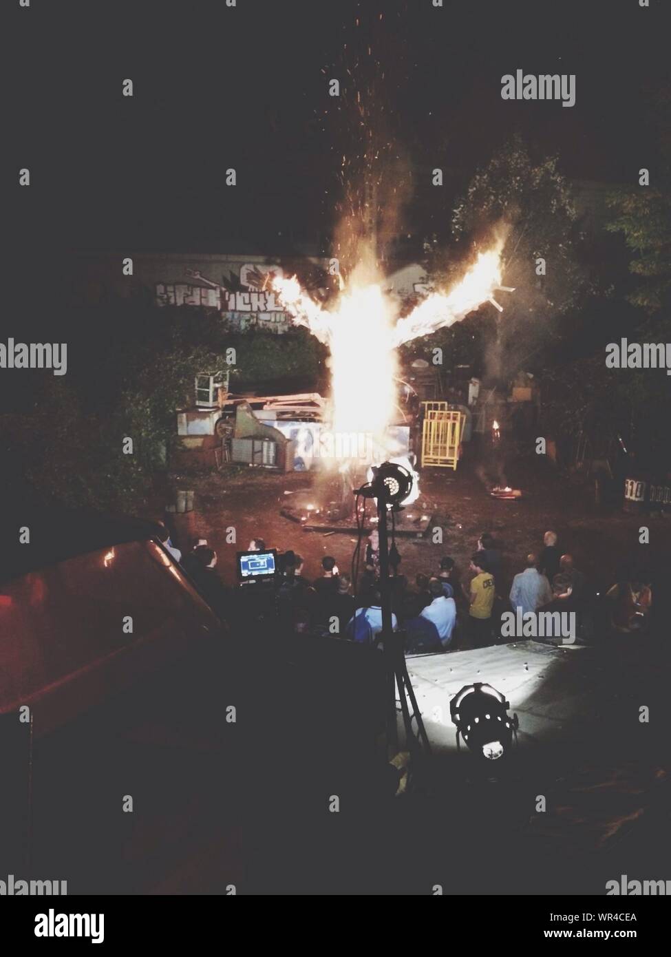 People In Front Of Burning Statue At Night Stock Photo Alamy