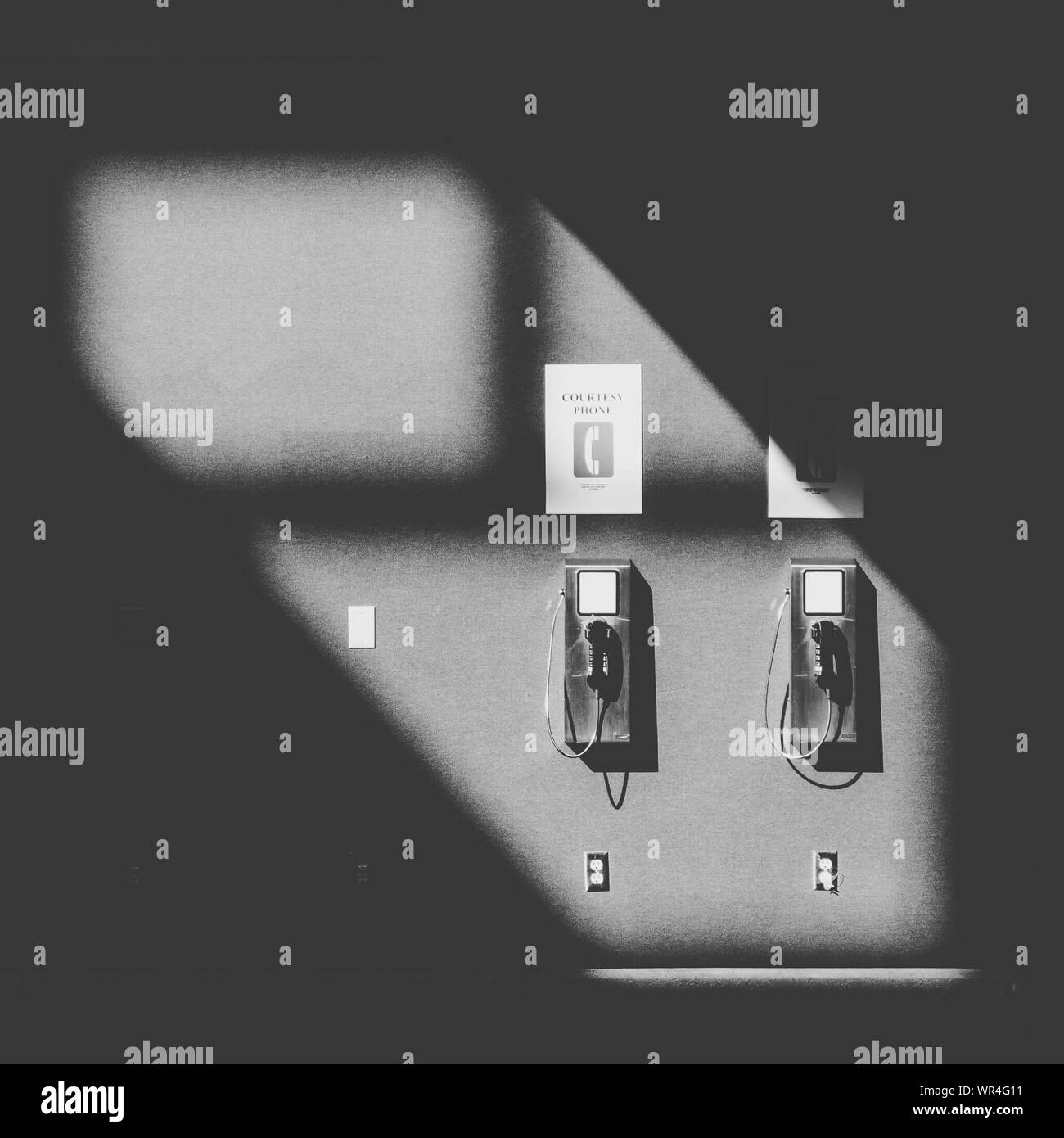 Old telephone mounted on wall hi-res stock photography and images - Alamy