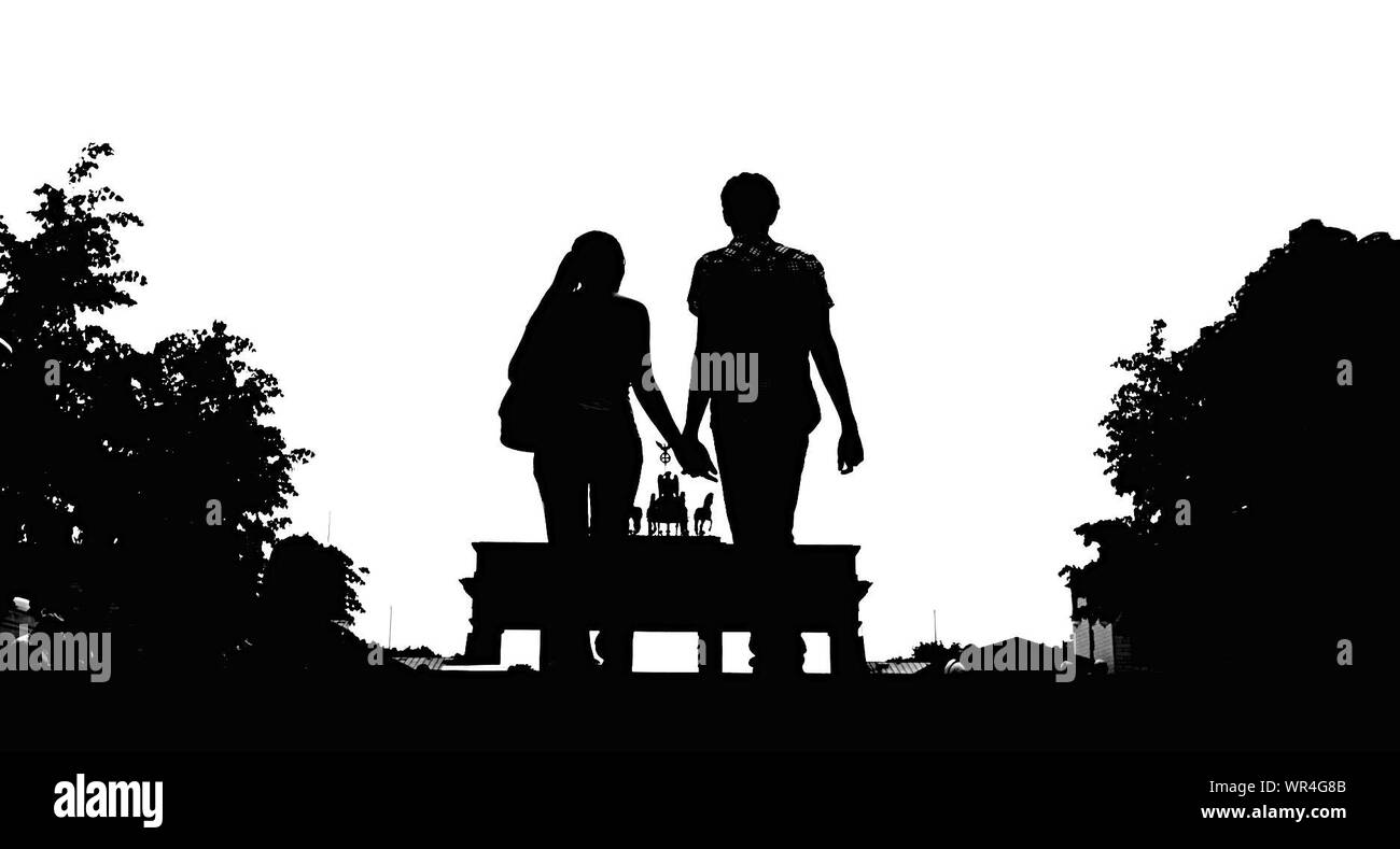 Silhouette Couple Holding Hands Walking High Resolution Stock ...