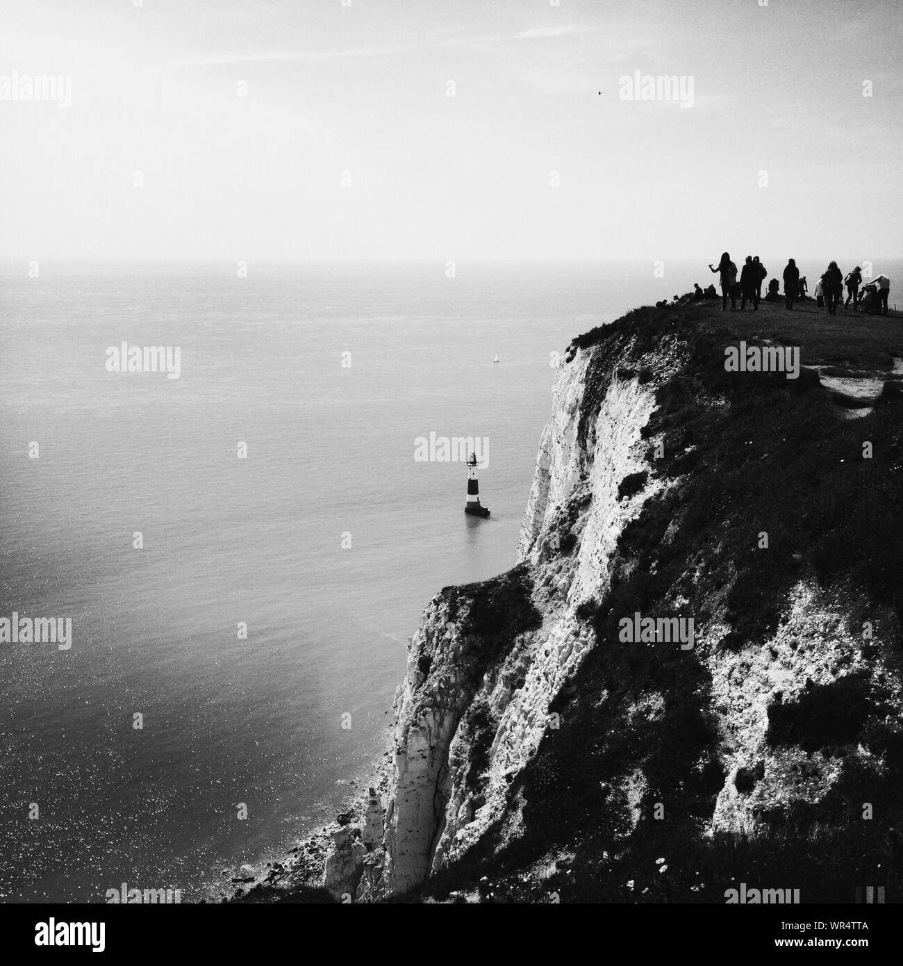 Black And White Scenery With Rock Cliff And Seaside Stock Photo