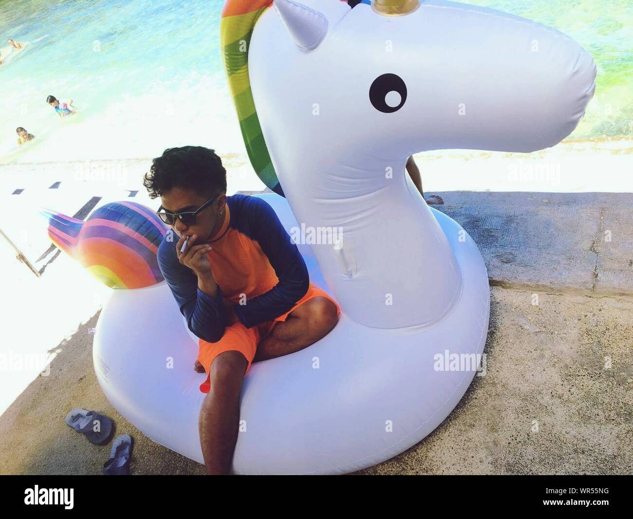 Man sitting on inflatable raft hi-res stock photography and images - Alamy