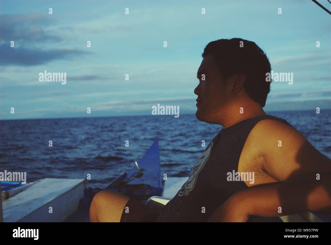 Indian man sitting on boat hi-res stock photography and images - Alamy