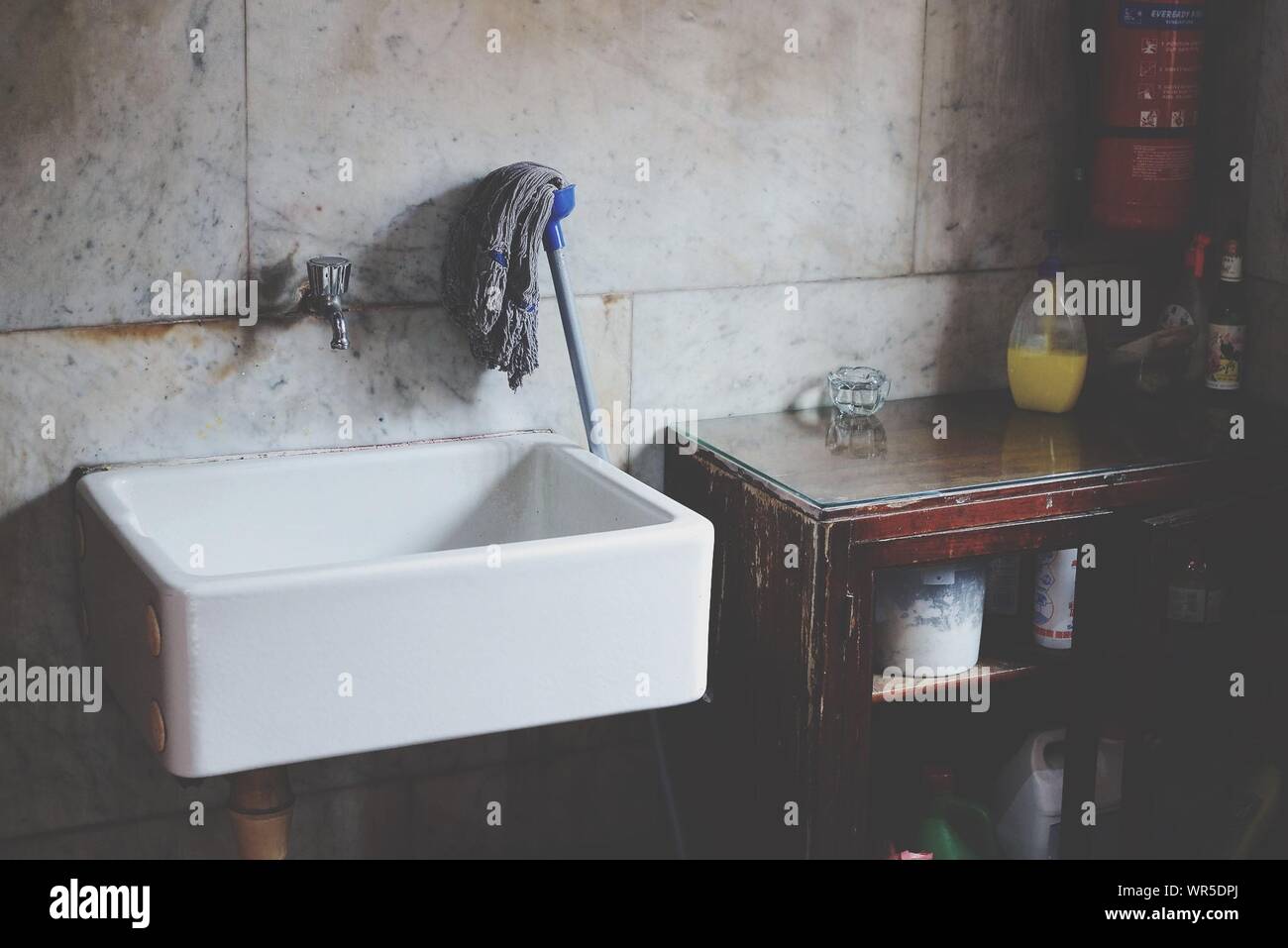Sink And Mop In Bathroom Stock Photo Alamy