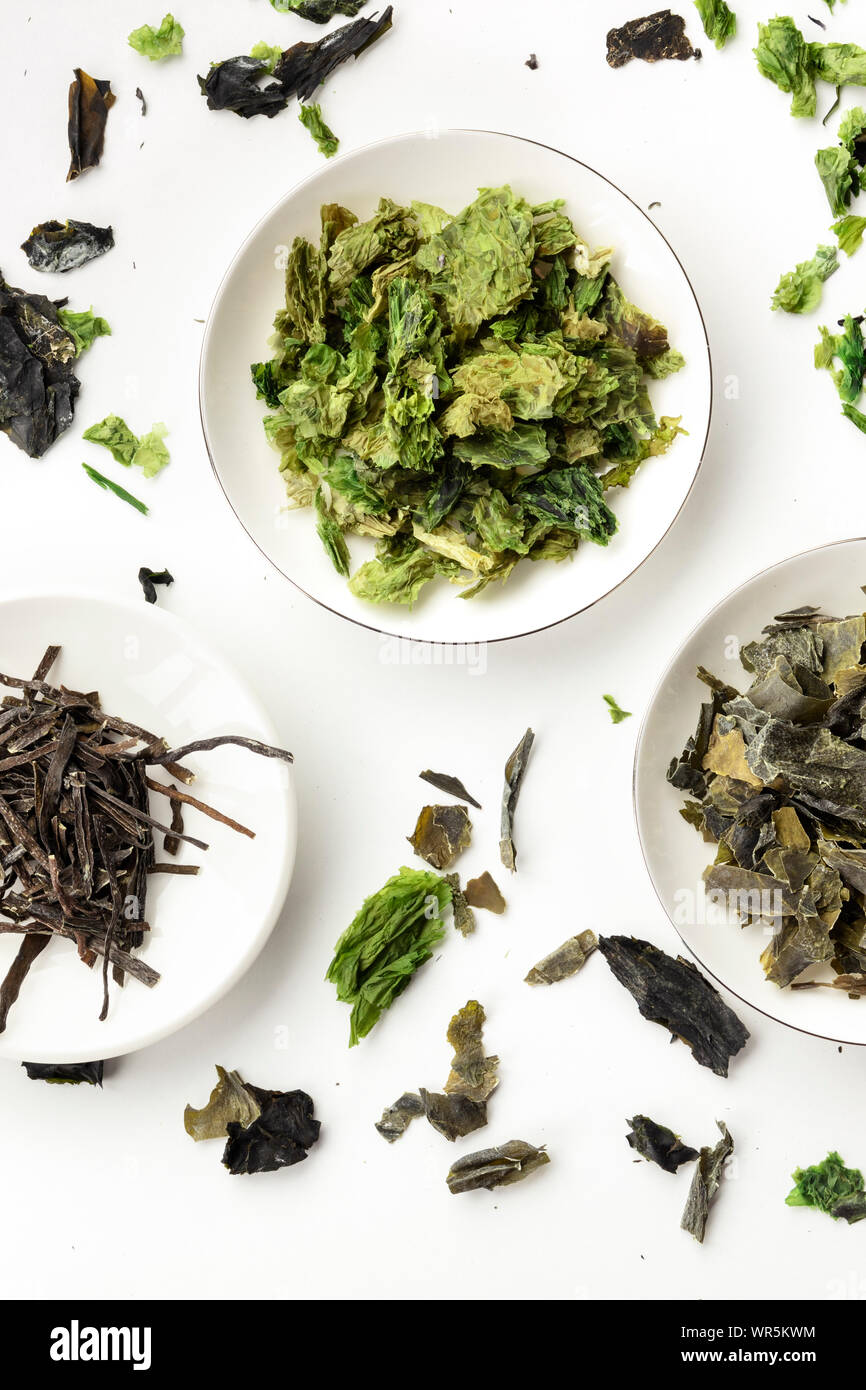Dry seaweed, sea vegetables, shot from above on white. Superfoods background Stock Photo