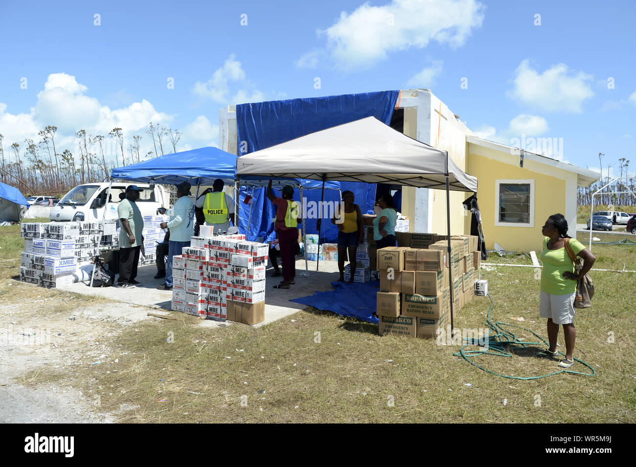 Treasure Cay, The Bahamas. 9th Sep 2019. MRE meal kits sit outside the damaged fire station at Treasure Cay Airport in the Bahamas on September 9, 2019. The stop on Treasure Cay, The Bahamas was conducted to provide consumable and medical products to the local population. The visit was coordinated by "Shipwreck Park", a 501 (c) (3) corporation which is responsible for the acceptance and distribution of relief goods, consumables and medical supplies for the island chain. Credit: UPI/Alamy Live News Stock Photo