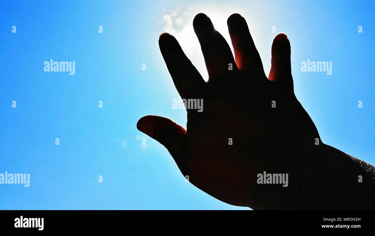 Hand reaching towards sunlight hi-res stock photography and images - Alamy