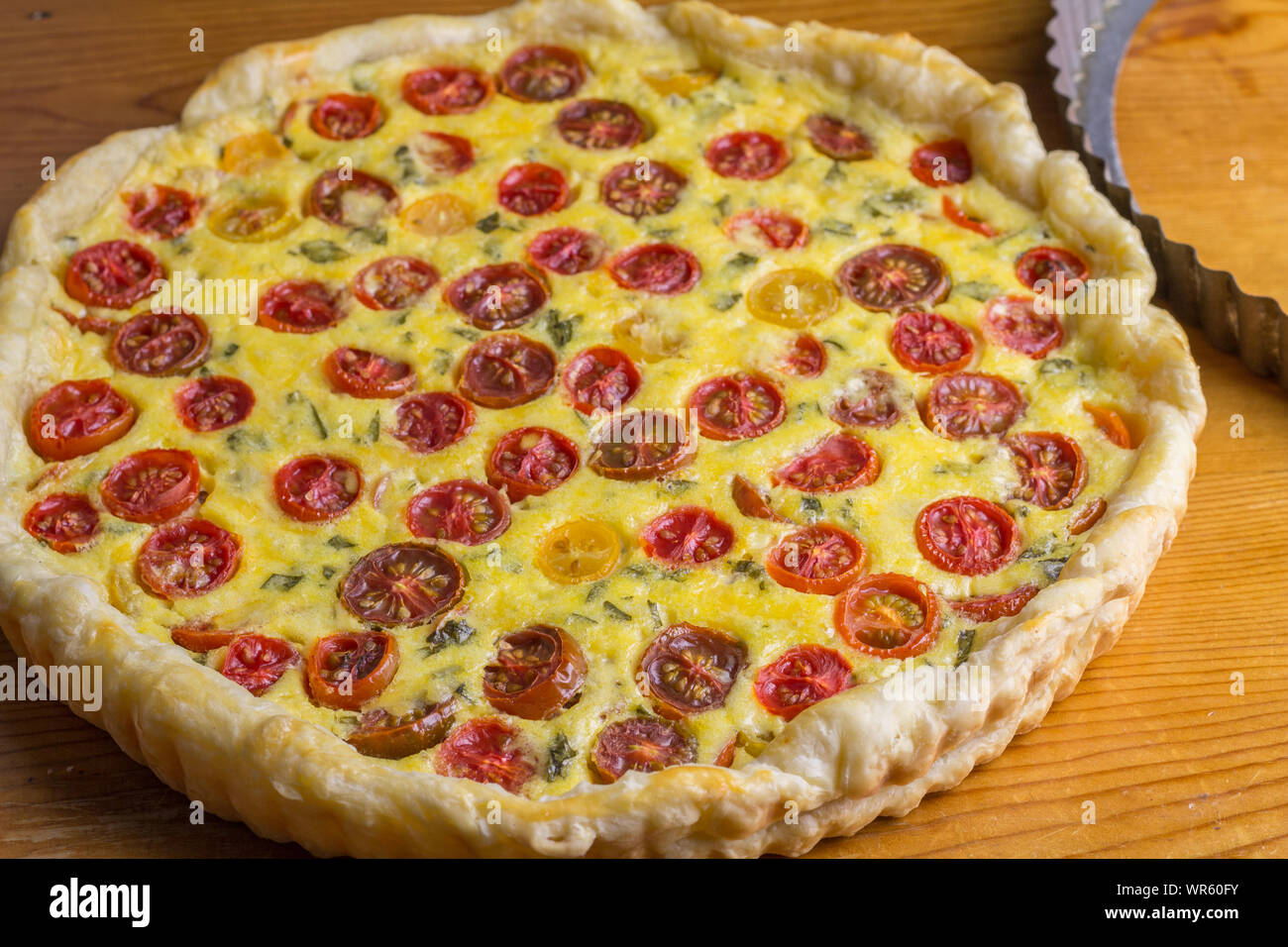 Cherry tomato tart horizontal image of puff pastry tomato cheese and