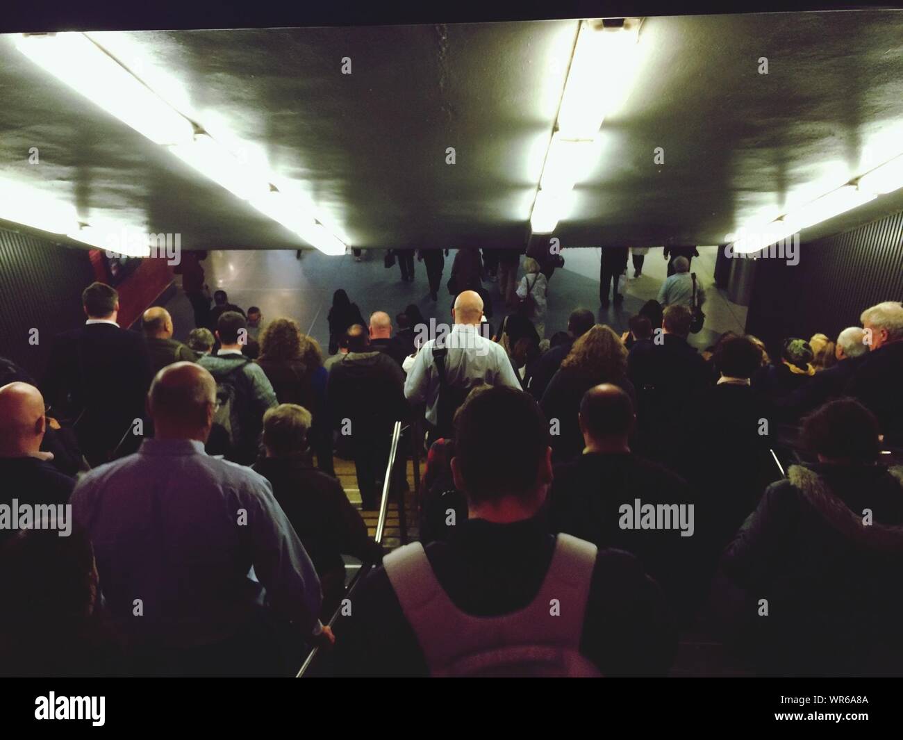 Crowd Going Down Tunnel Stock Photo Alamy