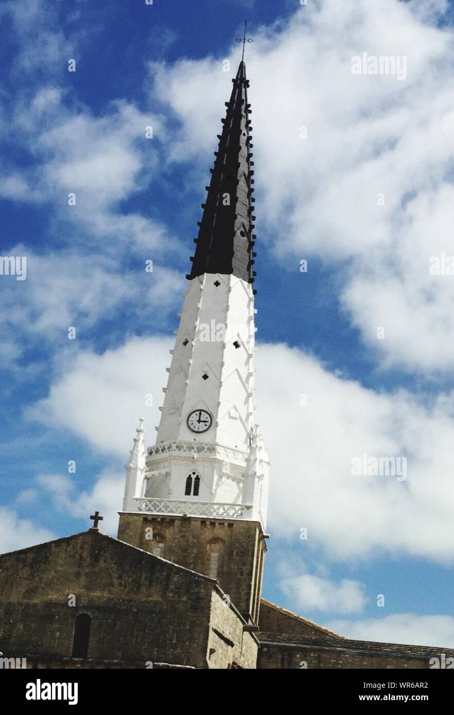 Low Angle View Of St Stephens Church Of Ars-en-re Against Cloudy Sky Stock Photo