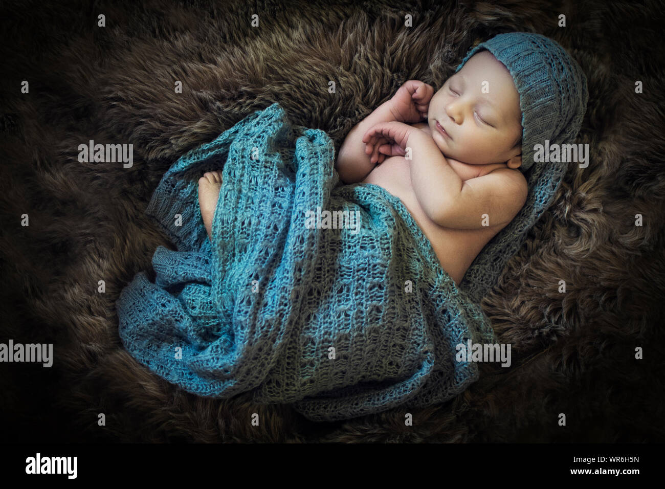 Infant wrapped in a blanket hi-res stock photography and images - Alamy
