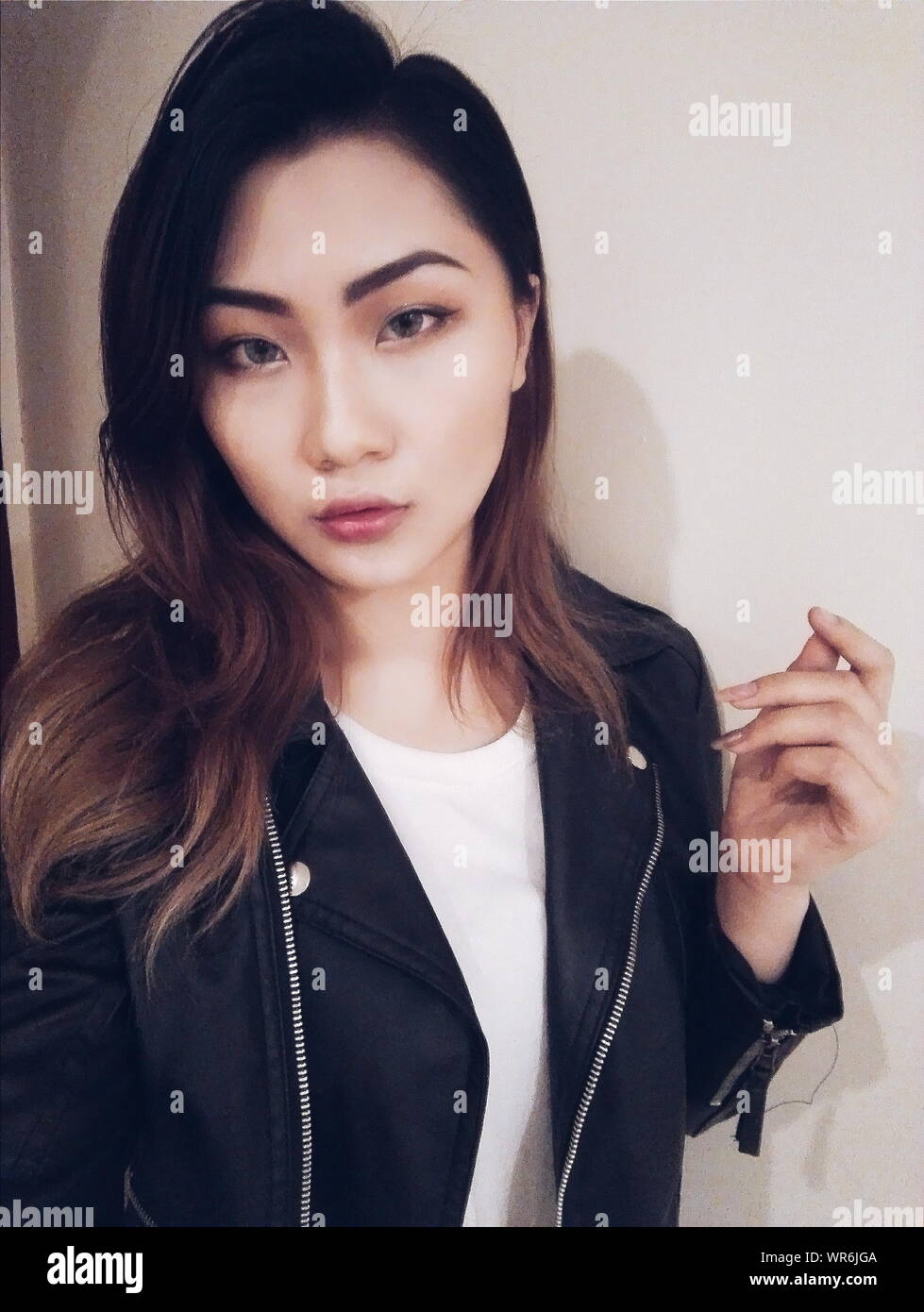 Asian woman in black leather jacket hi-res stock photography and images ...