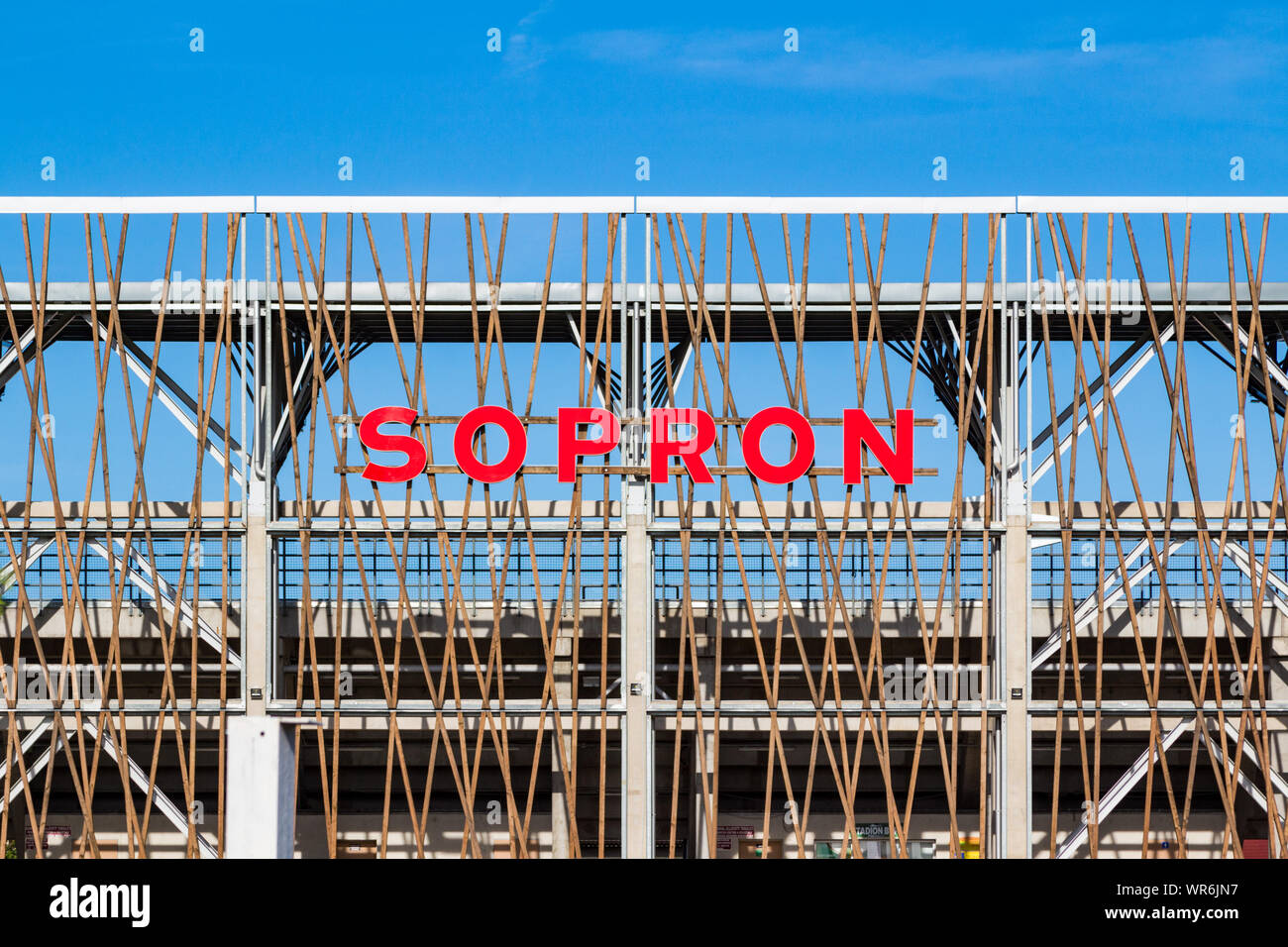 Local Stadium 'Városi Stadion' rear view of grandstand metal structure with the word 'Sopron' in red letters Stock Photo