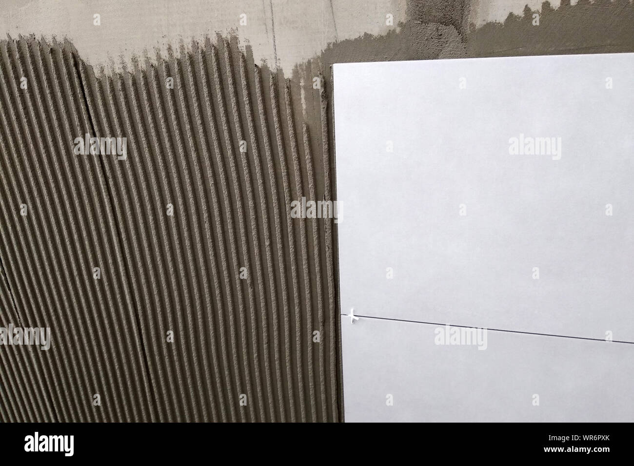 Wall ceramic tiles installation on mortar glue Stock Photo Alamy