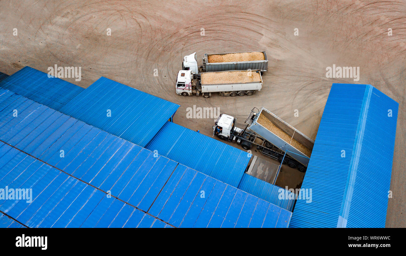 trucks with potatoes at the potato processing factory top view Stock Photo