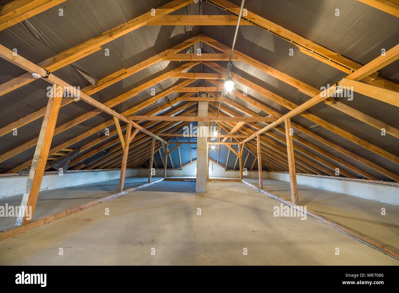 Attic of a building with wooden beams of a roof structure Stock Photo ...