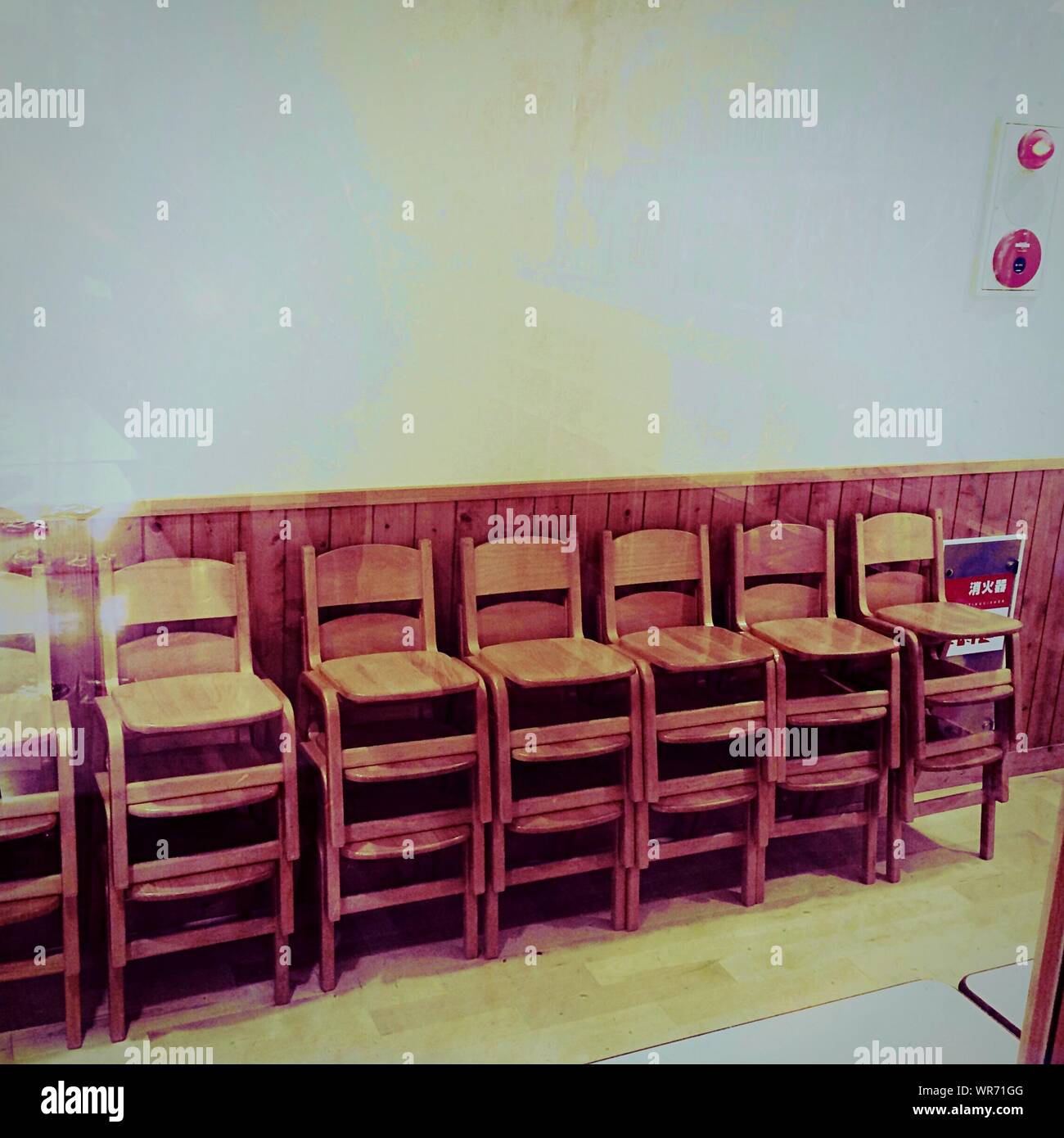 Stack On Chairs Against Wall In Building Stock Photo Alamy