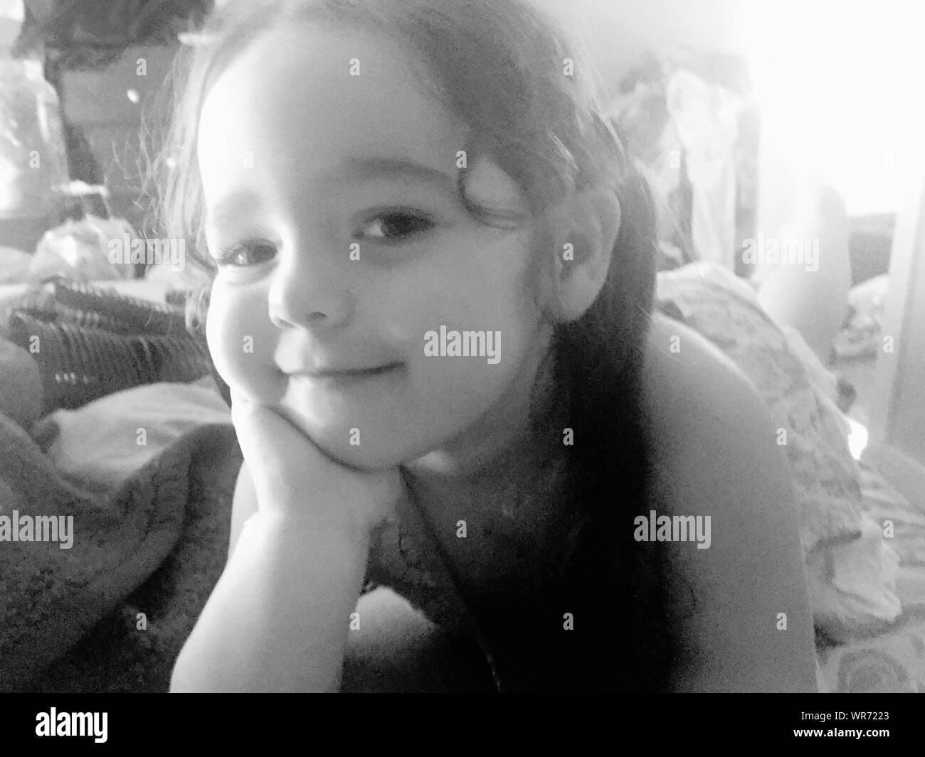 Portrait girl lying on bed hi-res stock photography and images - Alamy