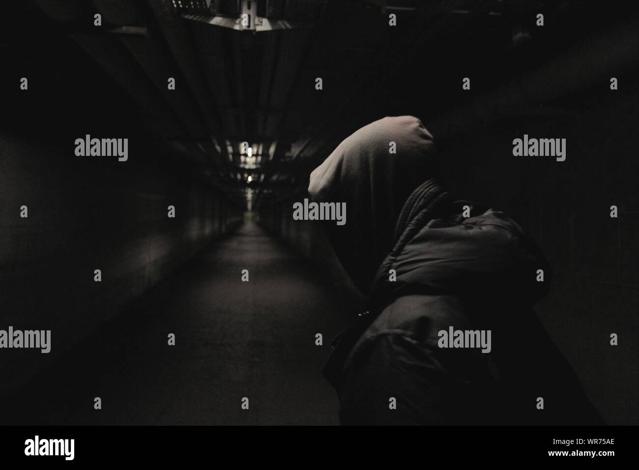 Man in the dark with hood hi-res stock photography and images - Alamy