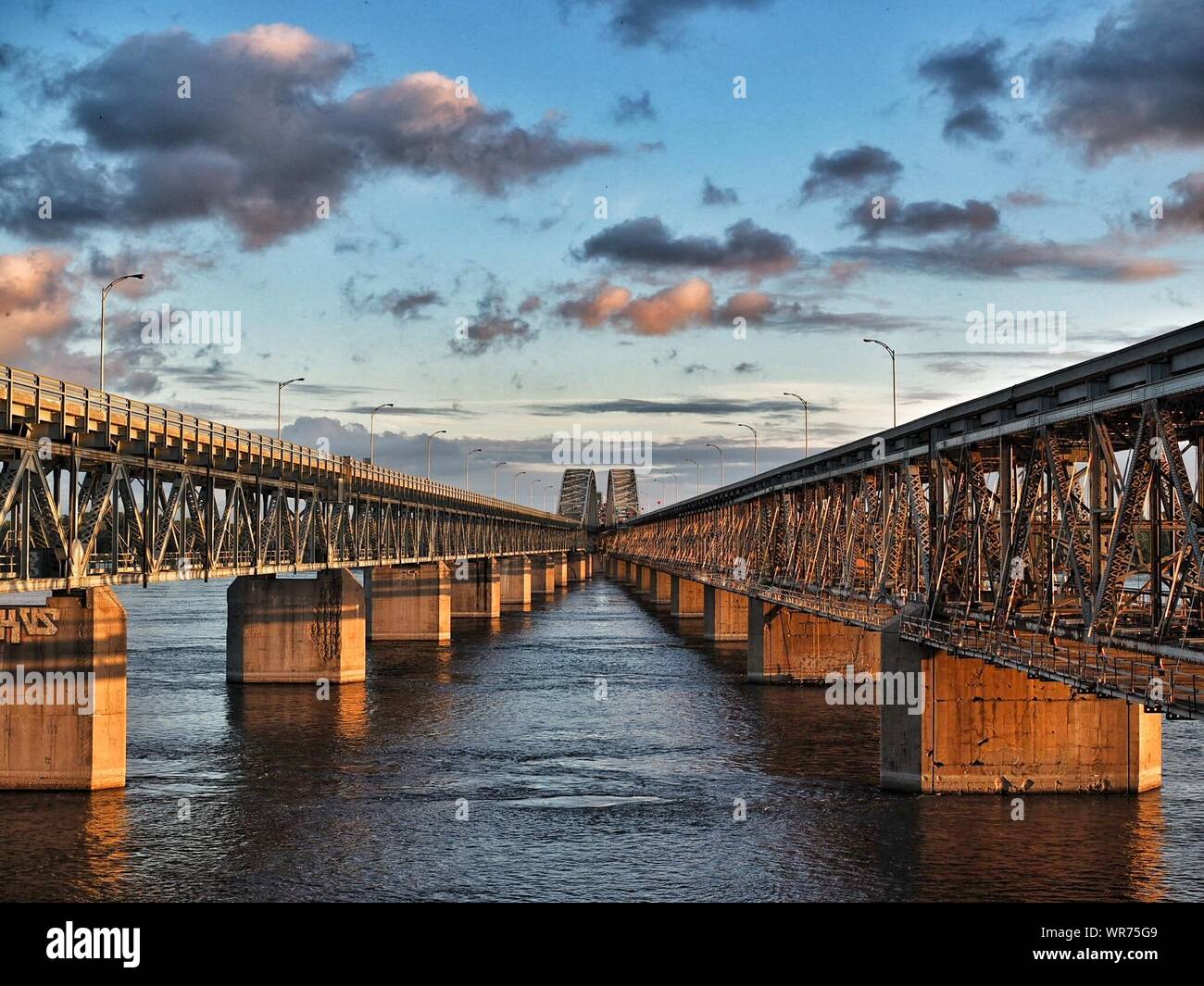 Honore Mercier Bridge Over Saint Lawrence River Against Sky Stock Photo