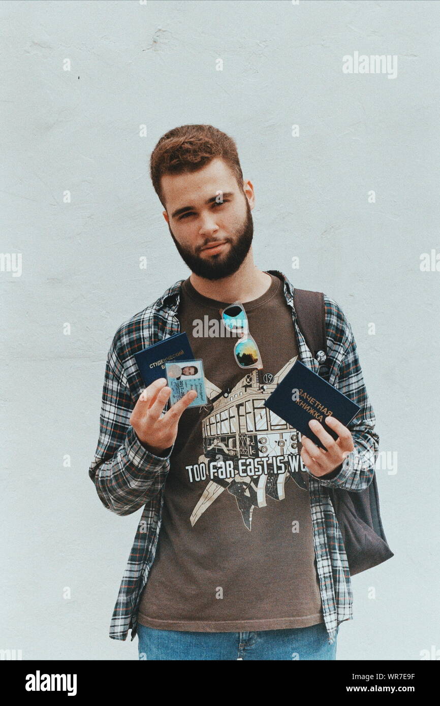 Picture Of A Man Holding Id Card