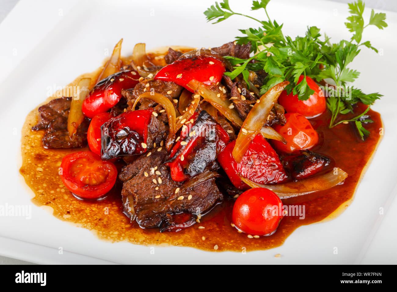 Beef in oyster sauce with tomato Stock Photo Alamy