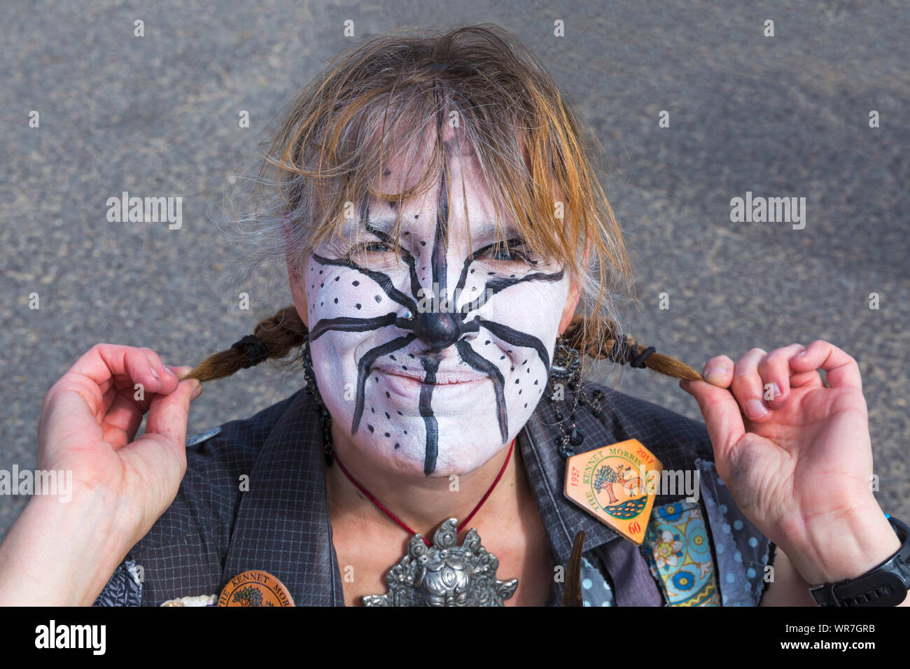 Scary spider painted on face of Morris dancer, member of Armaleggan Border Morris, at Swanage Folk Festival, Swanage, Dorset UK in September Stock Photo