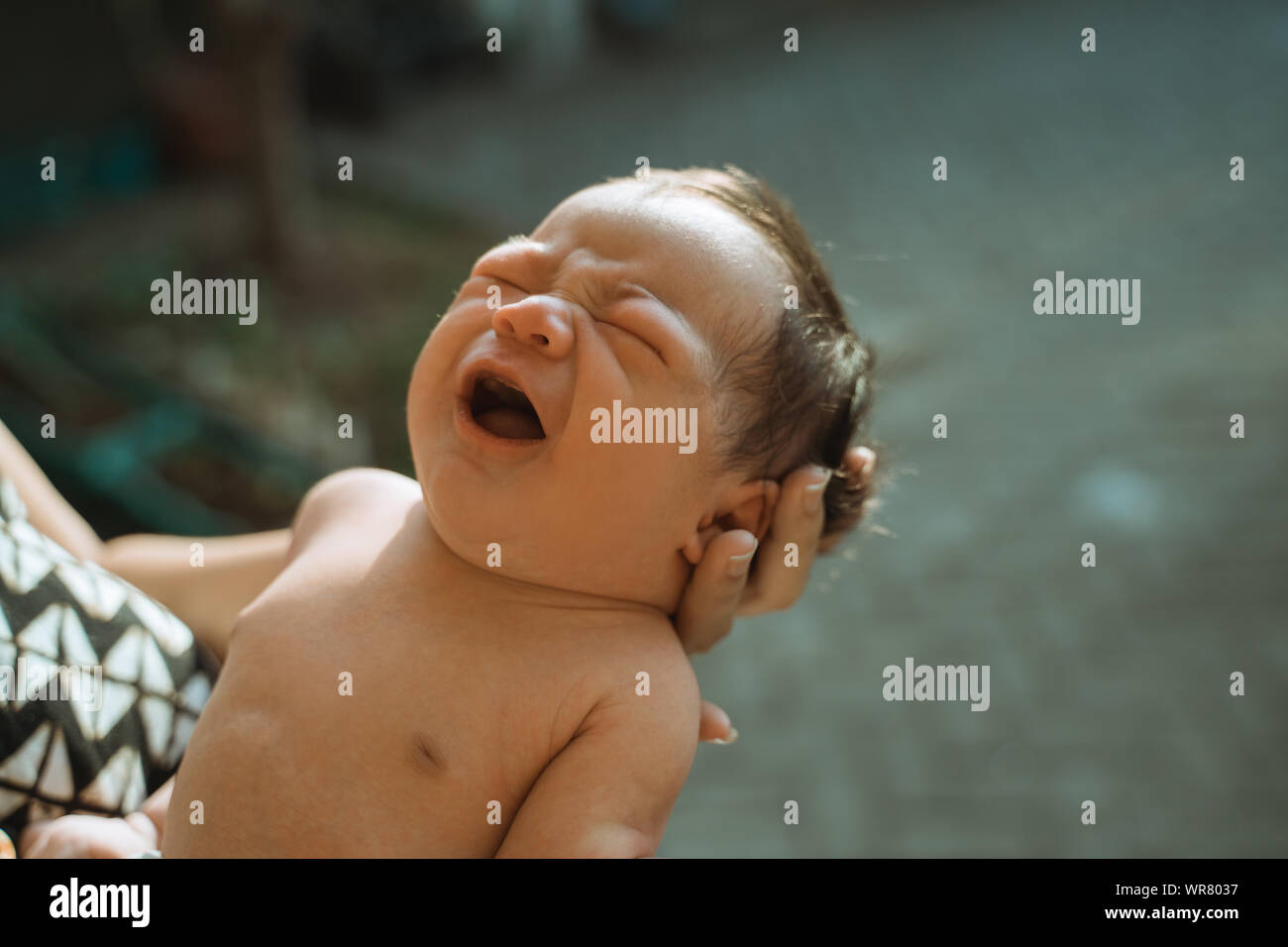 Cropped image of newborn sunbathing baby Stock Photo