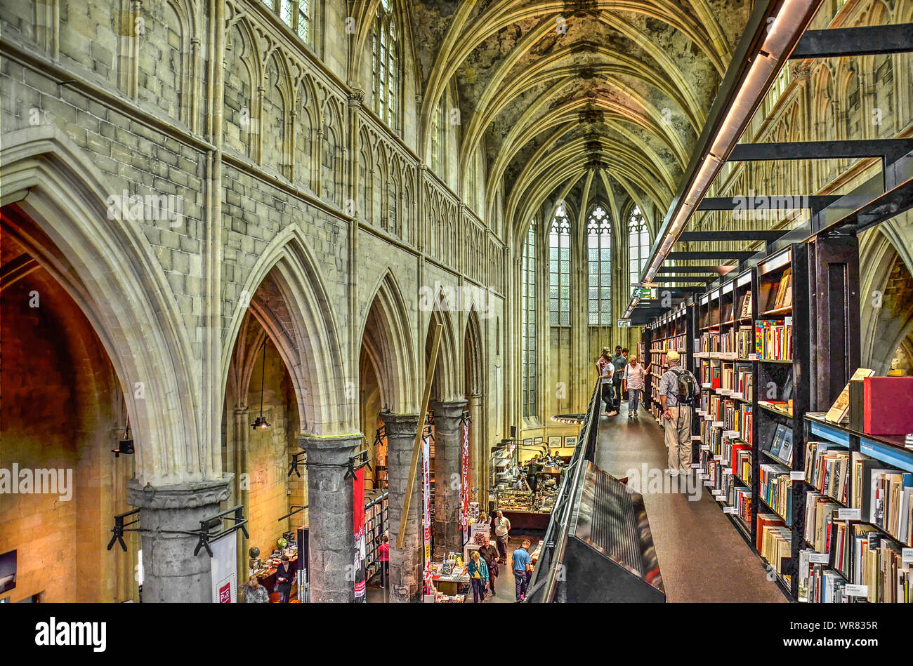 Maastricht, The Netherlands, September 8, 2019: view from one of the floors with books along the nave towards the chancel in de former Dominican churc Stock Photo