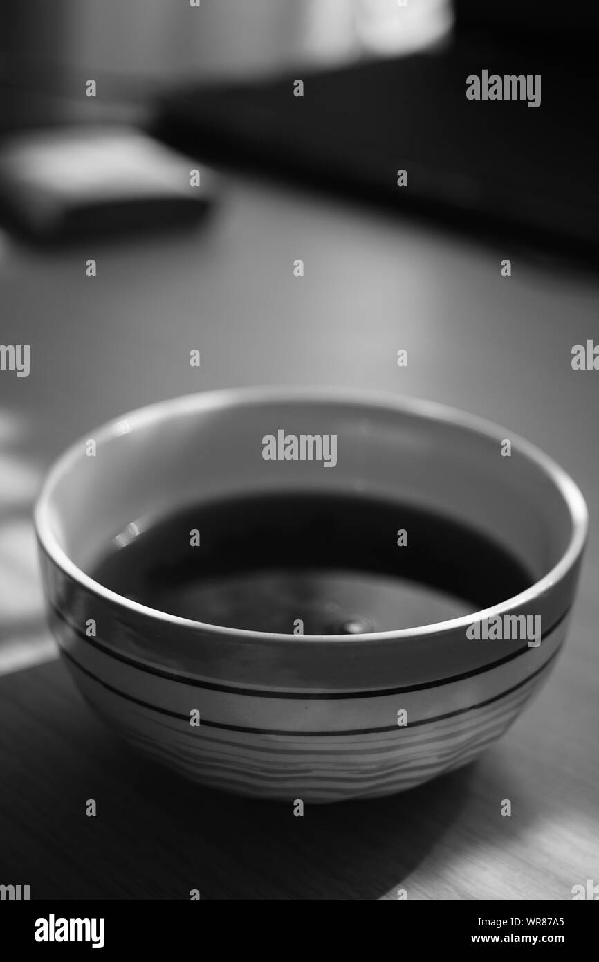 big round bowl with tea, bw photo. Stock Photo