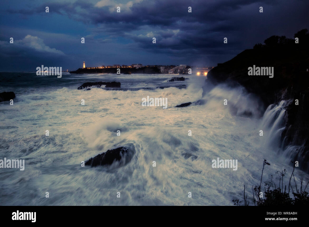 BIARRITZ COAST DURING A WINTER GALE - ROCHER DE LA VIERGE BIARRITZ - PEOPLE LOOKING AT THE PANORAMA  OF A SEA STORM ON BIARRITZ BELVEDERE - TEMPÊTE SUR LA CÔTE DE BIARRITZ EN PÉRIODE HIVERNAL - FRENCH COAST - RÉGION PAYS BASQUES AQUITAINE FRANCE - STORMY WEATHER - GALE - WAVES - LANDSCAPE PHOTOGRAPHY © Frédéric BEAUMONT Stock Photo