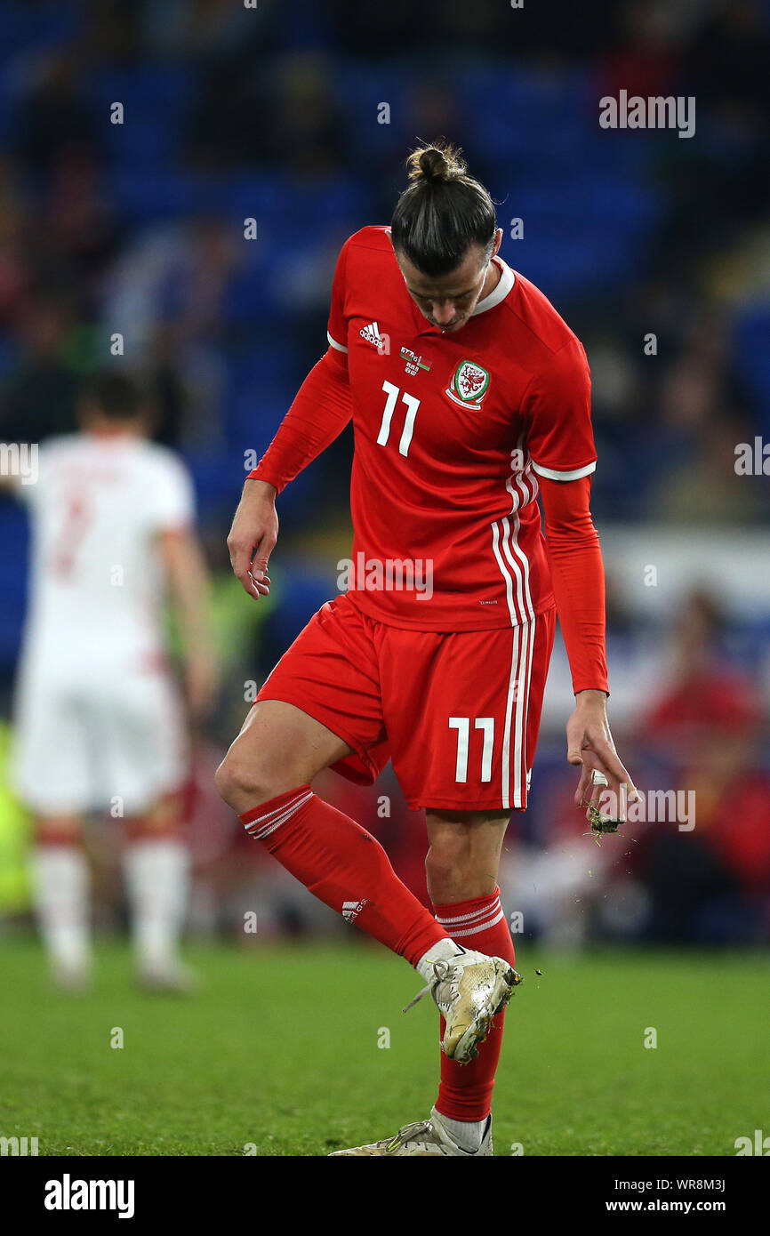 Cardiff, UK. 09th Sep, 2019. Gareth Bale of Wales clears grass and mud off  his boots during the game .Wales v Belarus, international challenge  friendly international football match at the Cardiff city