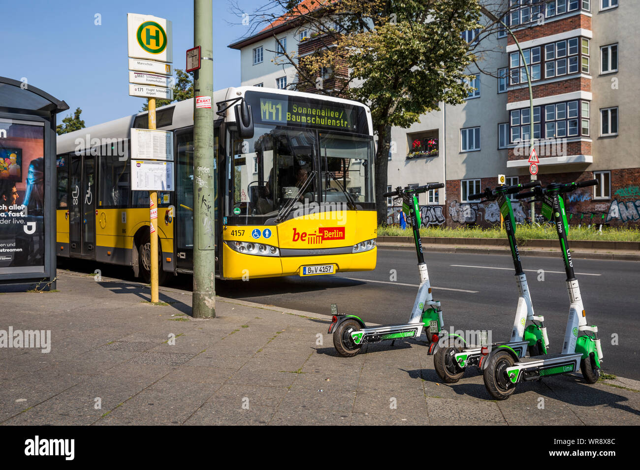 Lime escooters parked at a bus stop in the Neukolln area of Berlin