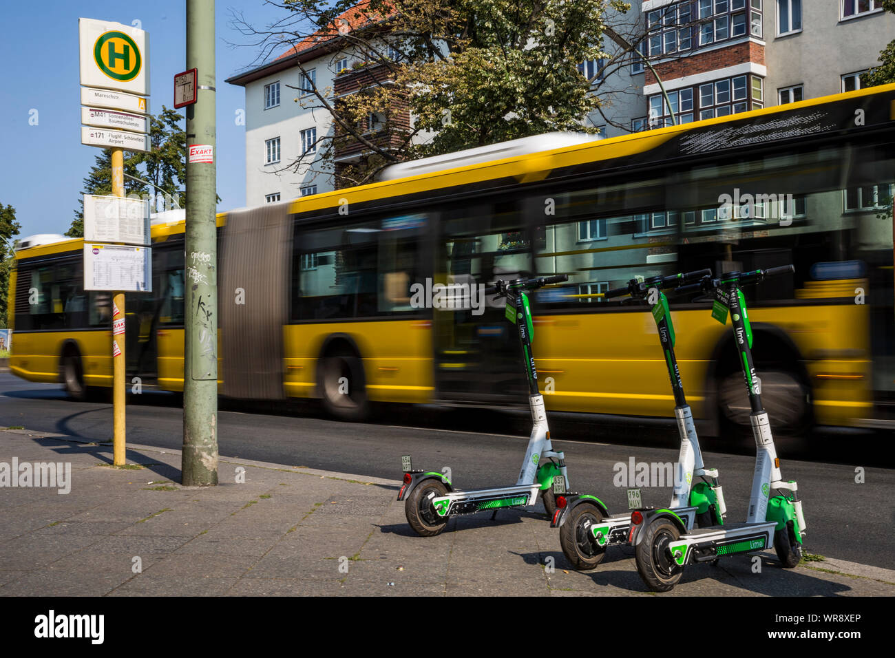 Lime escooters parked at a bus stop in the Neukolln area of Berlin