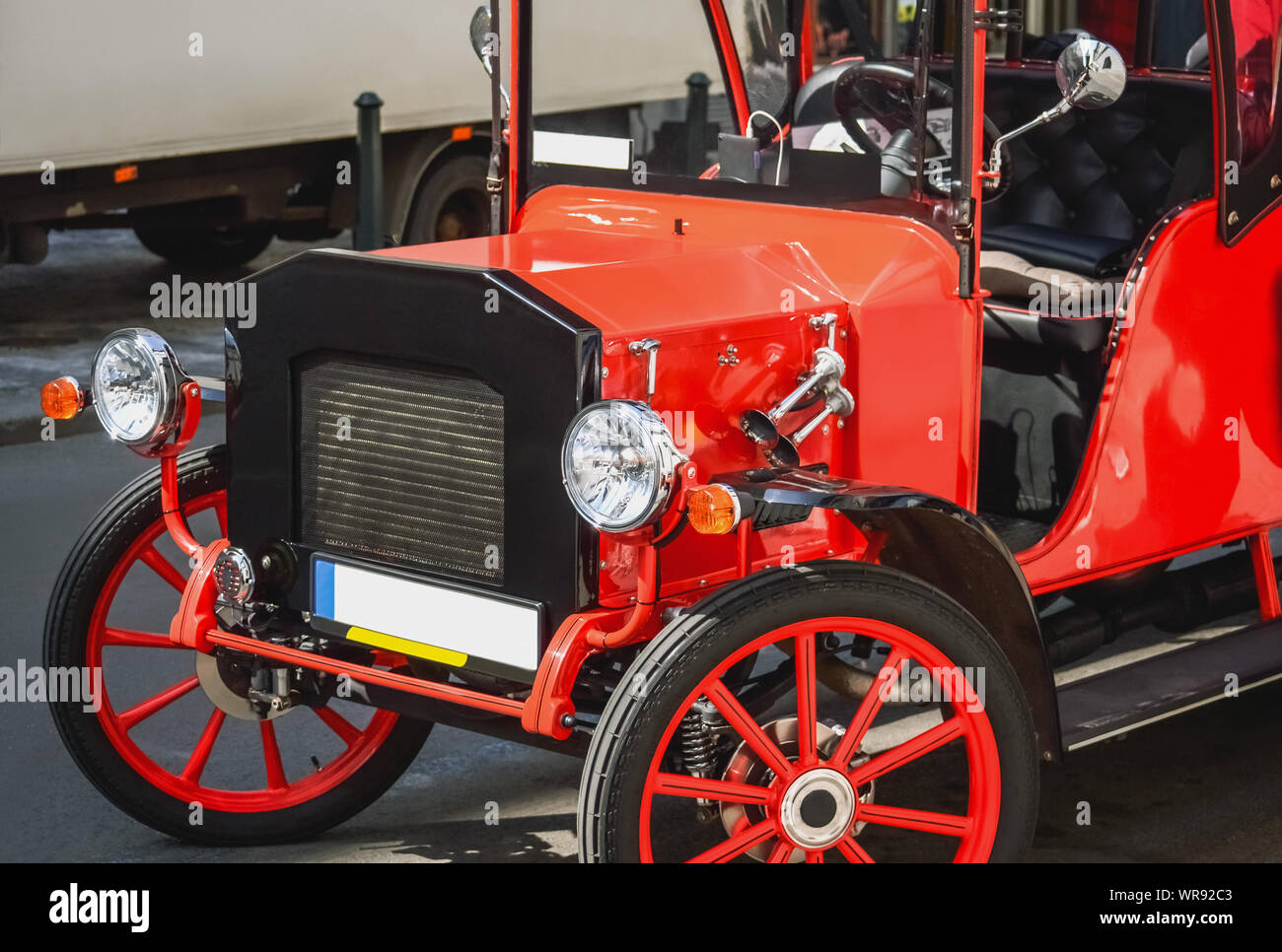 Front part of a reconstructed old style car in red color Stock Photo
