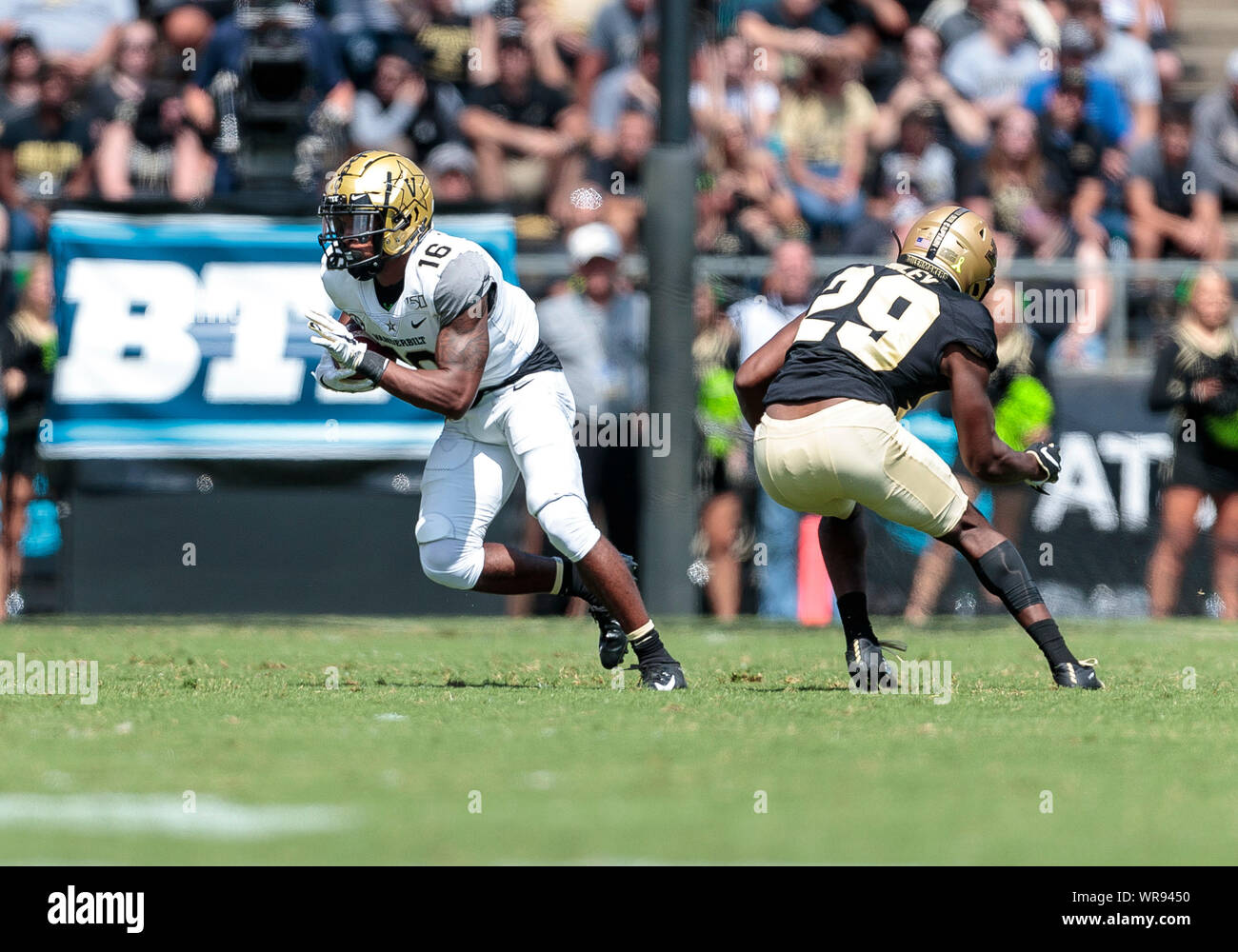 West Lafayette, Indiana, USA. 07th Sep, 2019. Vanderbilt wide receiver Kalija Lipscomb (16) runs with the ball as Purdue defensive back Simeon Smiley (29) pursues during NCAA football game action between the Vanderbilt Commodores and the Purdue Boilermakers at Ross-Ade Stadium in West Lafayette, Indiana. Purdue defeated Vanderbilt 42-24. John Mersits/CSM/Alamy Live News Stock Photo