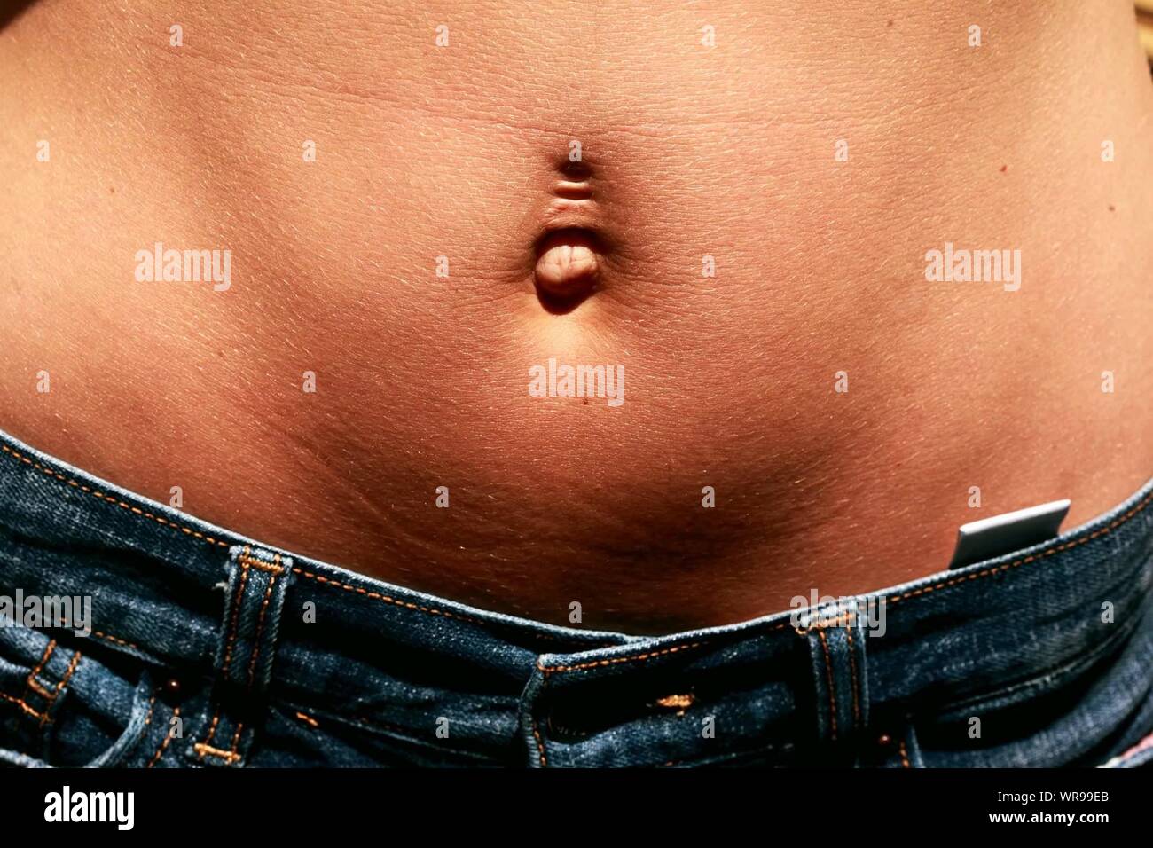 Pierced belly button hi-res stock photography and images - Alamy