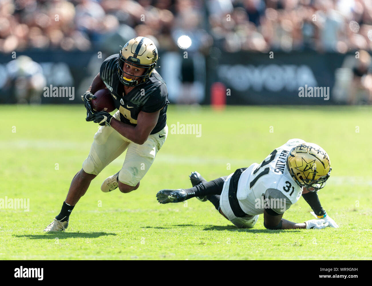 West Lafayette, Indiana, USA. 07th Sep, 2019. Purdue wide receiver Rondale Moore (4) catches the ball as Vanderbilt defensive back Cam Watkins (31) defends during NCAA football game action between the Vanderbilt Commodores and the Purdue Boilermakers at Ross-Ade Stadium in West Lafayette, Indiana. Purdue defeated Vanderbilt 42-24. John Mersits/CSM/Alamy Live News Stock Photo