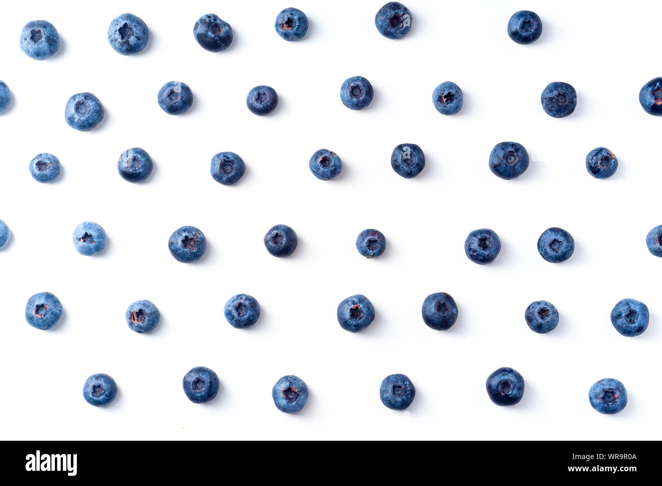 Flatlay pattern with fresh ripe blueberries isolated on white background Stock Photo