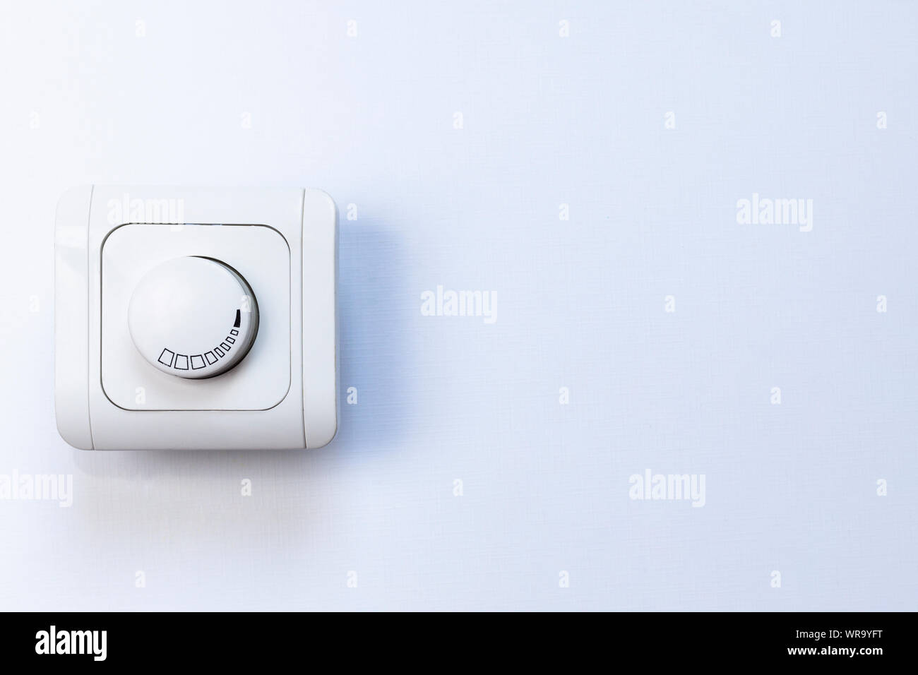 Dimmer Light Switch. Electrician switch. White rolling electricity